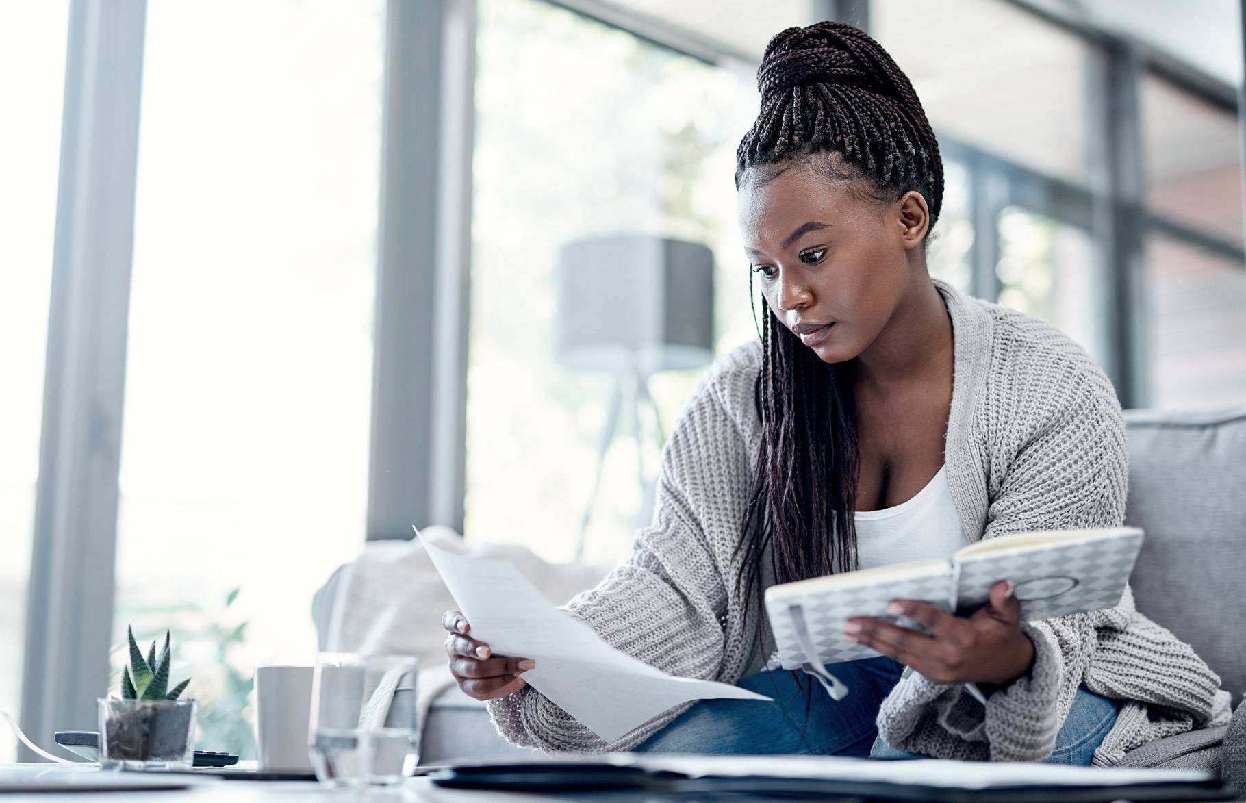 Woman checks her costs at home